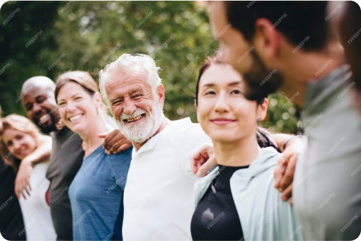 People smiling with arms wrapped around each other’s shoulders
